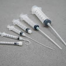 Syringe with white soft tube